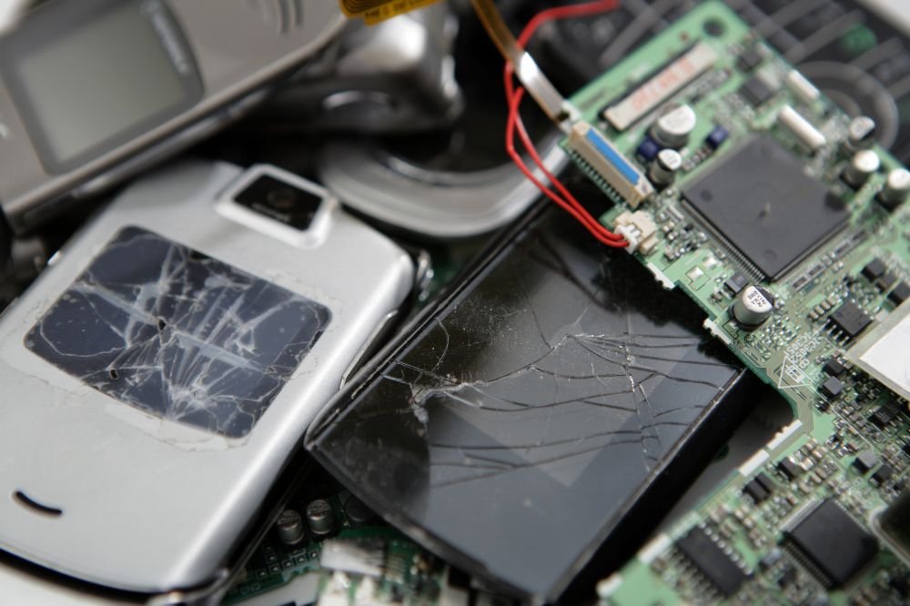 Water-damaged cell phones and circuit board with cracked screens